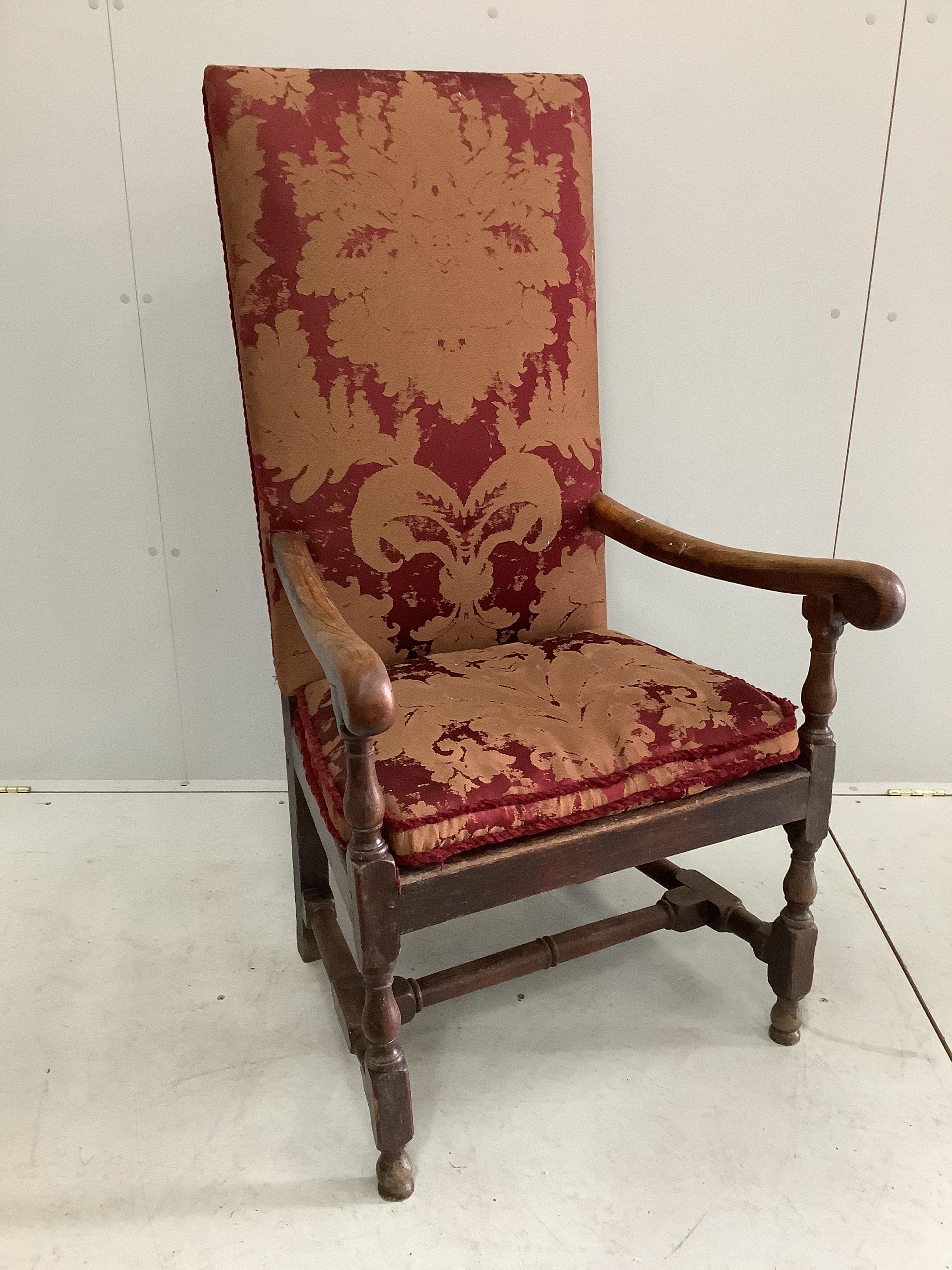 An 18th century style upholstered oak armchair, width 68cm, depth 51cm, height 125cm